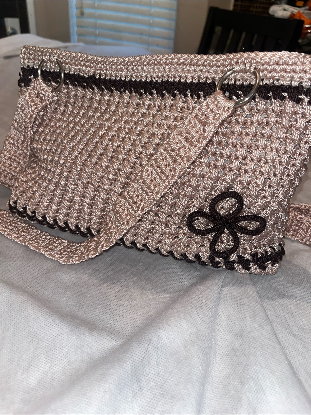 Woven Shoulder Bag in Light Tan with Black Trim and Floral Accent